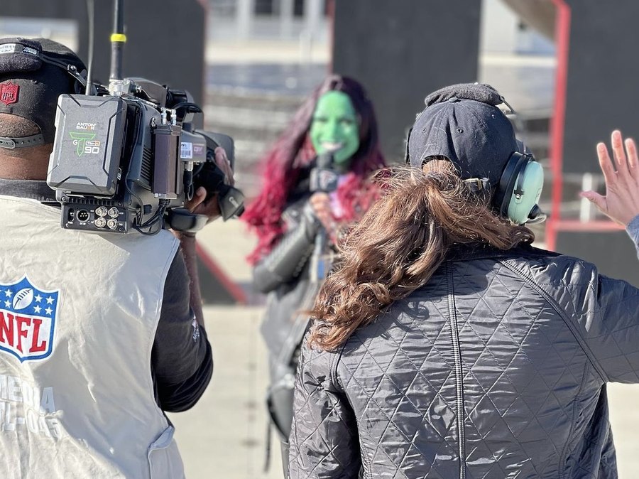 Chelsea in full costume character doing a live hit for an NFL Media camera crew