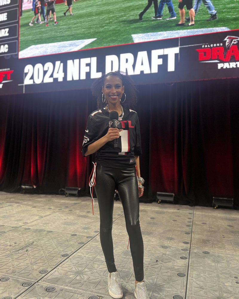 Chelsea in a Falcons jersey on the 2024 NFL Draft party stage