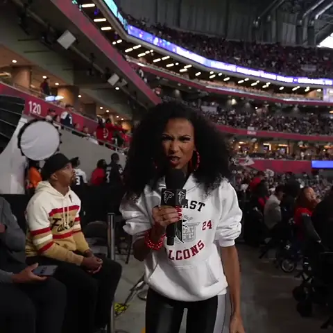 Looping clip: Chelsea dancing with fans in the stands at a Falcons game